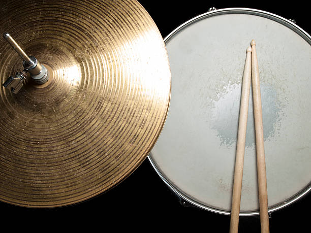 worn drumsticks on the snare drum and hi hat, for music,entertainment themes